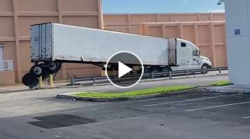 Semi-Truck Loses Back Wheels Trying to Turn Around Safety Barriers