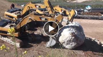 Excavator rolls the rock with team work...