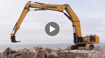 The Giant 220 Tons Custom Built Cat 6015B Triple Long Reach Excavator Working On A Pier
